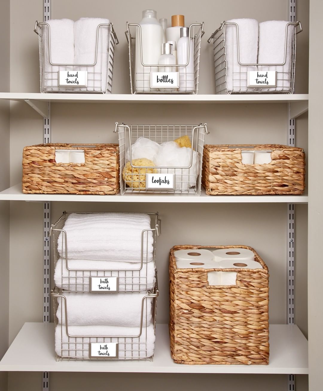 Towels and Toiletries Stored in Decorative Bins in Linen Closet. Photo by Instagram user @idlivesimply