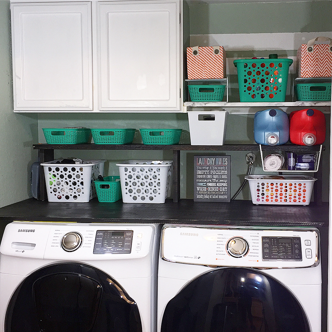 Laundry Room with Plastic Bins for Storage. Photo by Instagram user @unboxeddesigns