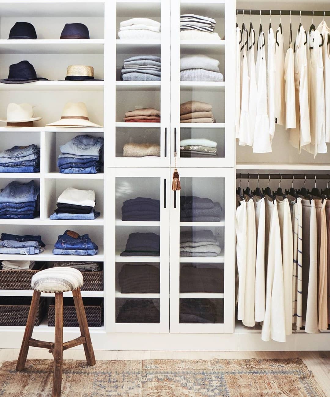 Closet Filled with Clothes, Pants, and Hats. Photo by Instagram user @jamienaugleinteriors