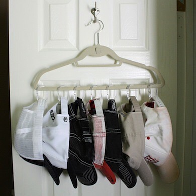 Hallway Closet with Hats on a Hanger. Photo by Instagram user @organizerjanet