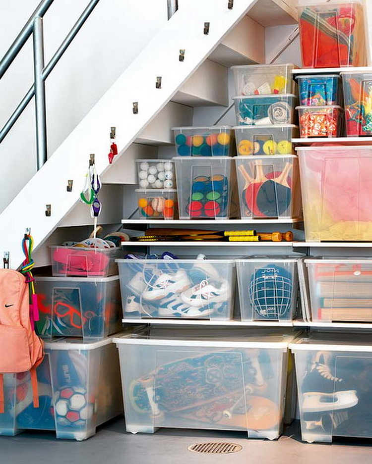 Storage bins on shelves with small hangers going up the stairs.