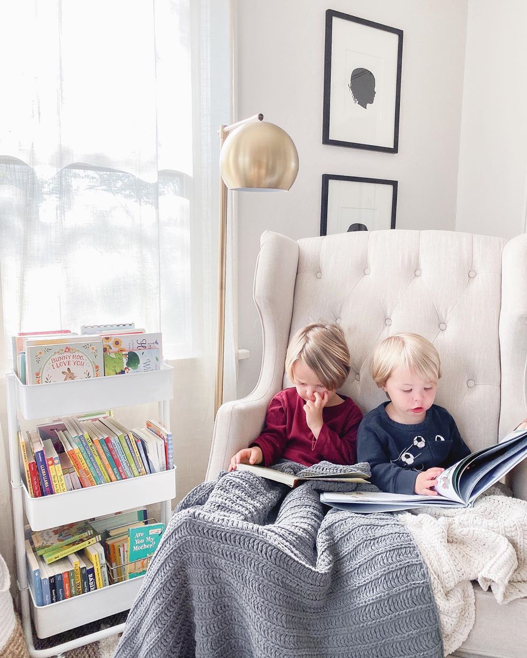 Little Kids Sitting Together Reading Books. Photo by Instagram user @brittanysbookclub