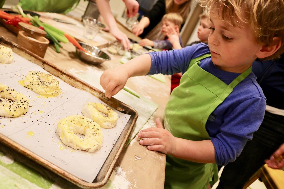 Young Child Participating in a Cooking Class. Photo by Instagram user @freshmadenyc