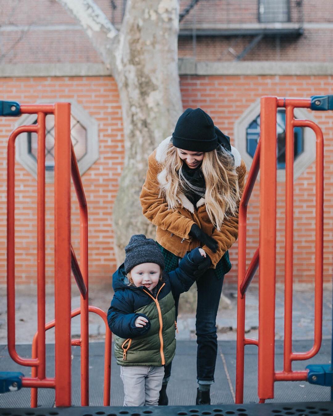 Woman Leading a Toddler Onto a Jungle Gym. Photo by Instagram user @hailey.marie.andresen
