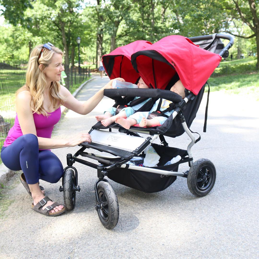 Woman Bottle-Feeding One of Her Two Babies Sitting Inside a Stroller in Central Park. Photo by Instagram user @kristinmcgee