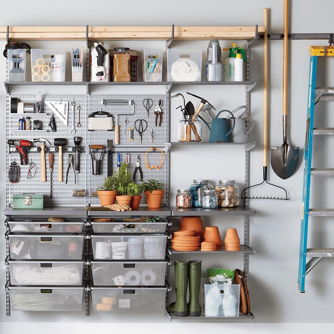 adjustable shelving in a shed for hanging tools photo by Instagram user @thecontainerstore