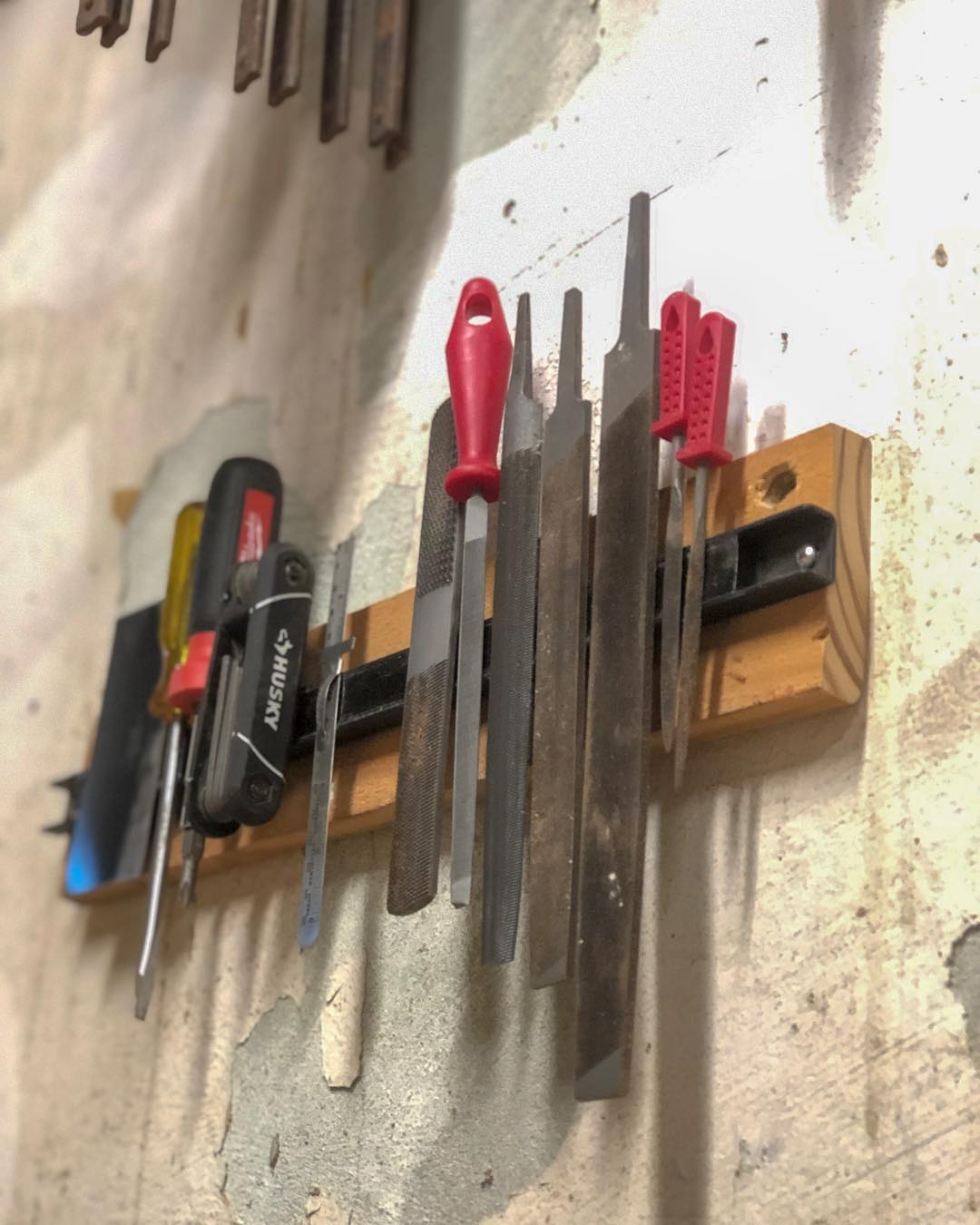 magnetic strip holding extra metal tools photo by Instagram user @cowdogcraftworks