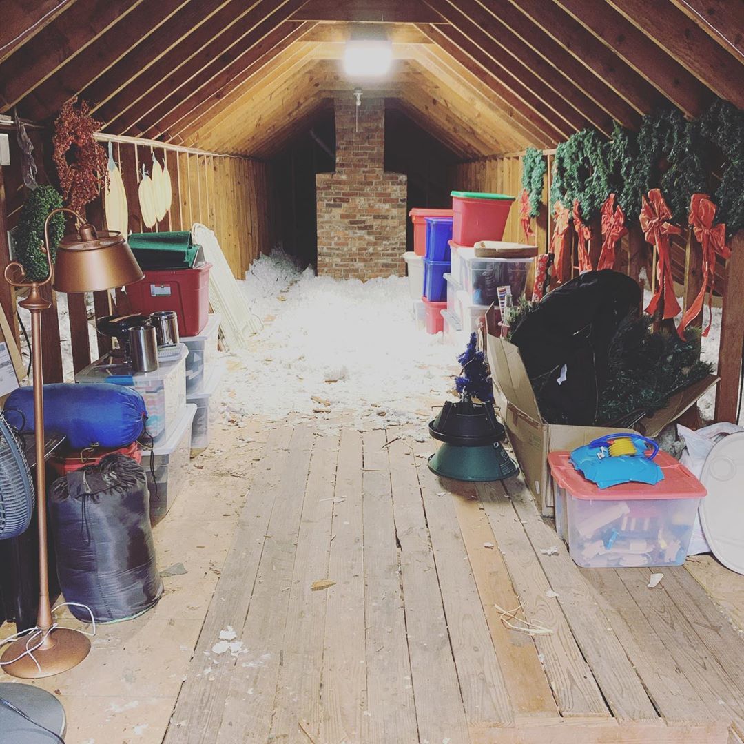 Attic storage space with items hanging. Photo by Instagram user @bitsandbobsnashville