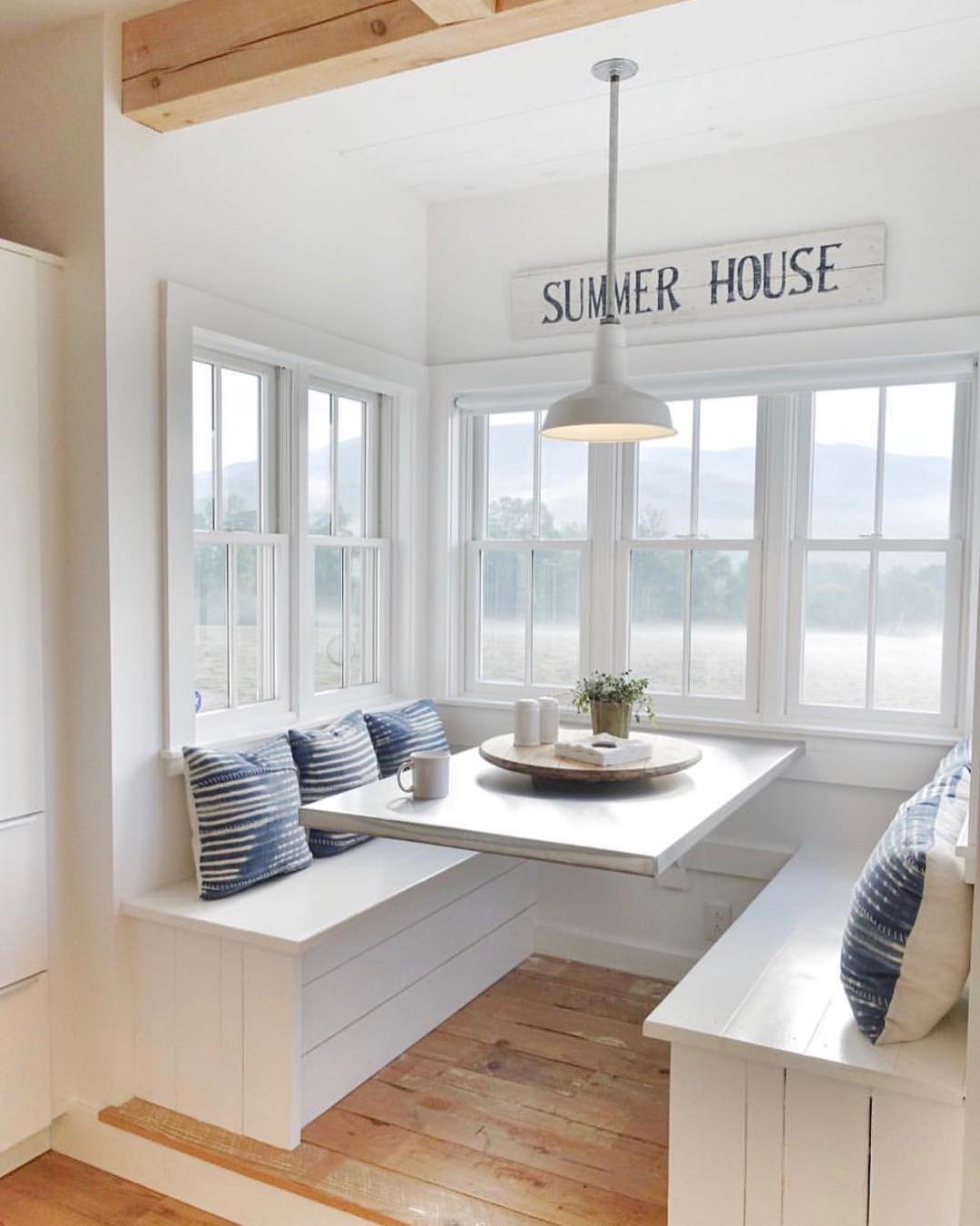 Breakfast Nook in Kitchen with Built-in Benches. Photo by Instagram user @withthecombs