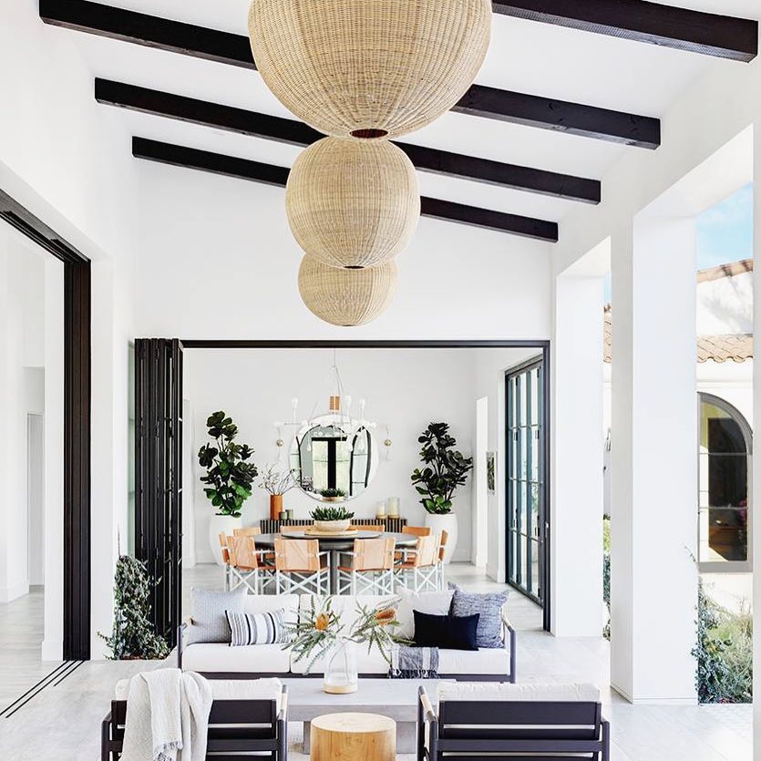 Large Sliding Doors Open to Outdoor Living Room. Photo by Instagram user @karinaplotkointeriors