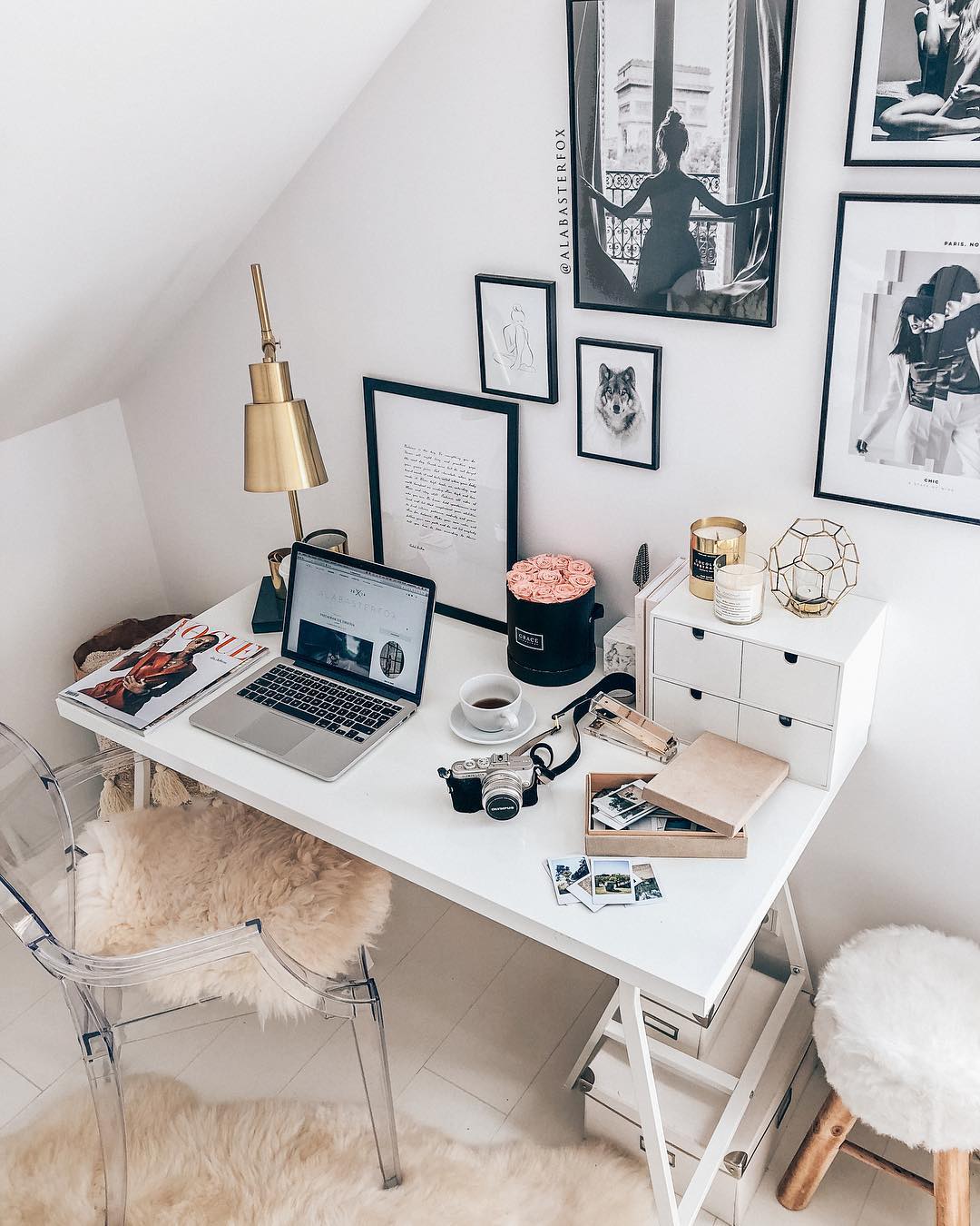 small white desk and clear chair with gold lamp on the desk in tiny room photo by Instagram user @alabasterfox