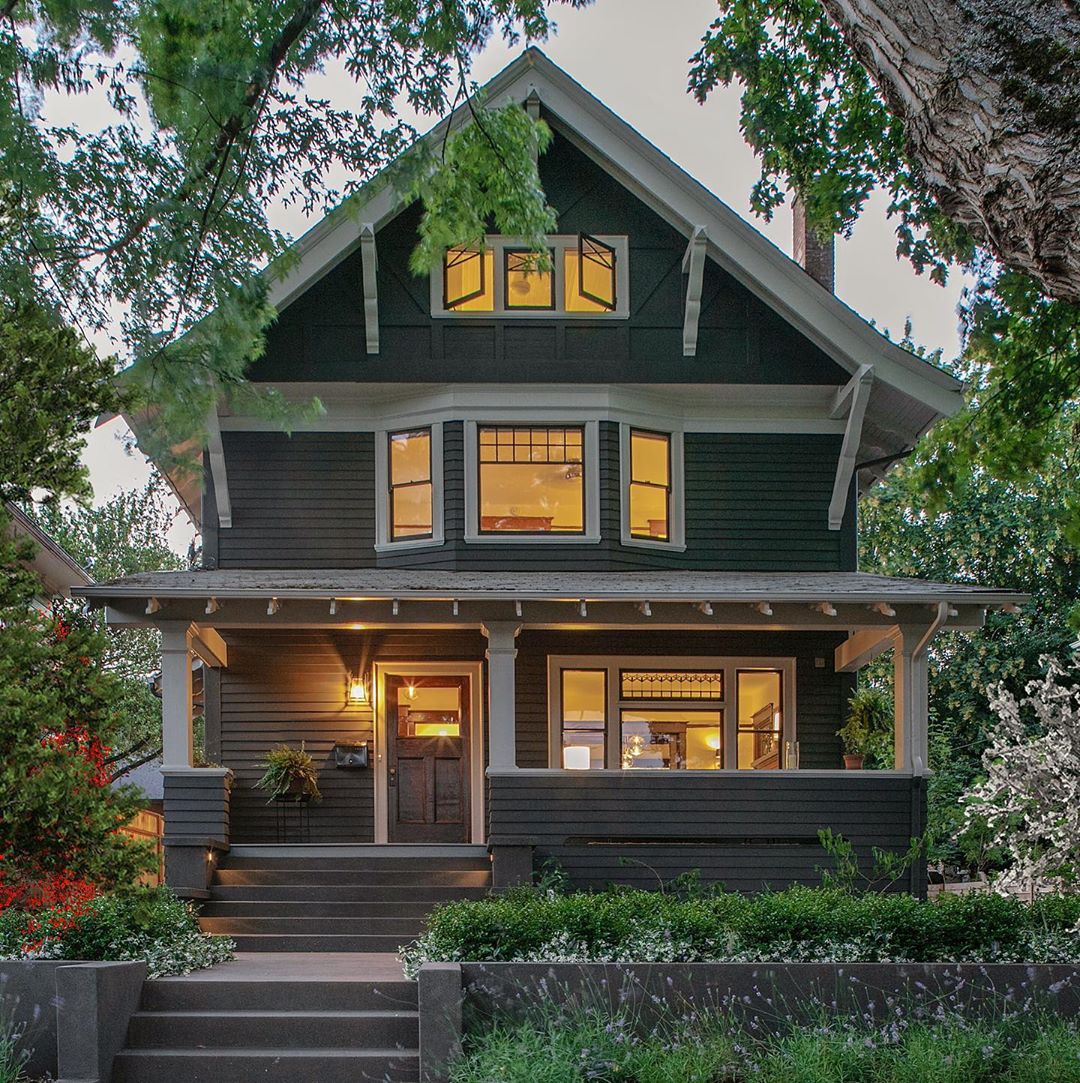 Craftsman-style house at twilight. Photo by Instagram user @bungalowsandcottages