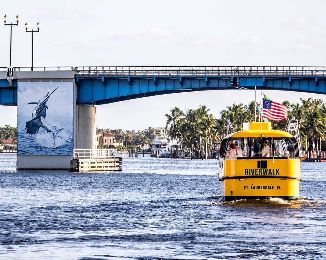 Water taxi strolls through a canal in Fort Lauderdale. Photo by Instagram user @fortlauderdalewatertaxi