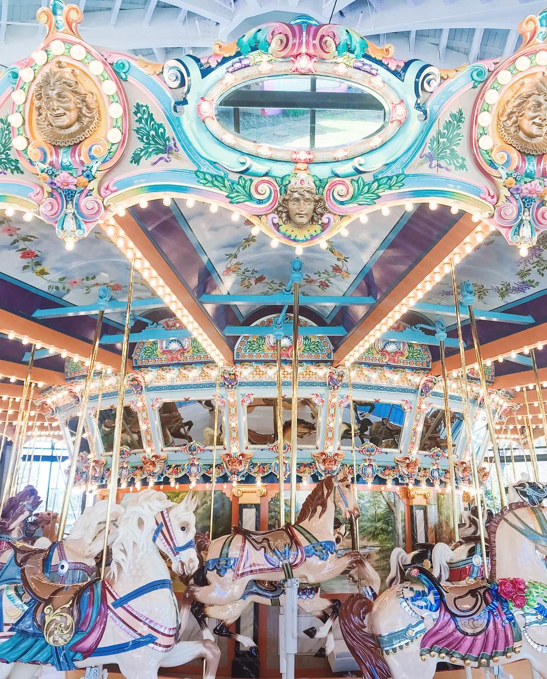 A magical light pink and blue merry-go-round with horses. Photo by Instagram user @alice.kerley