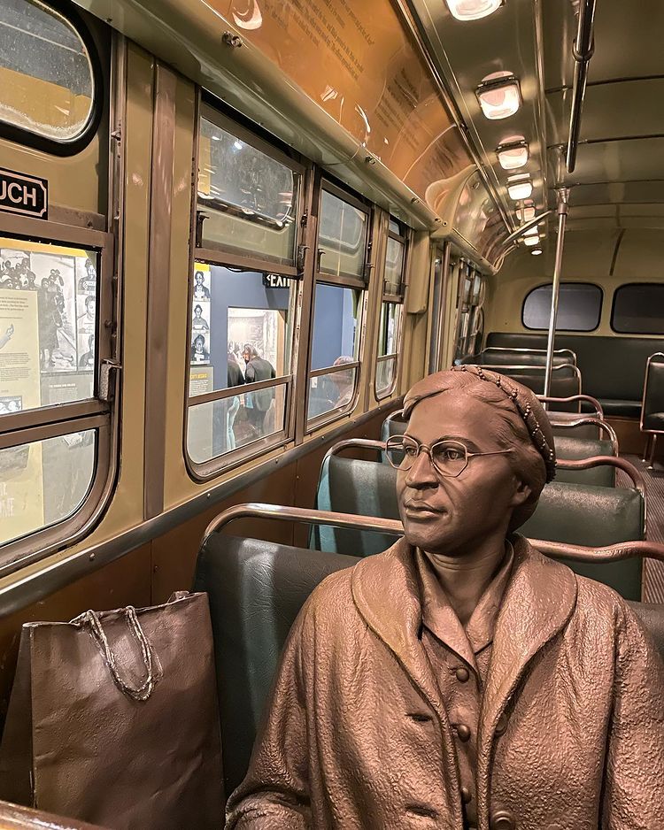 Photo of bronze statue of Rosa Parks sitting in the front of the bus at the National Civil Rights Museum in Memphis. Photo by Instagram user @michelleely