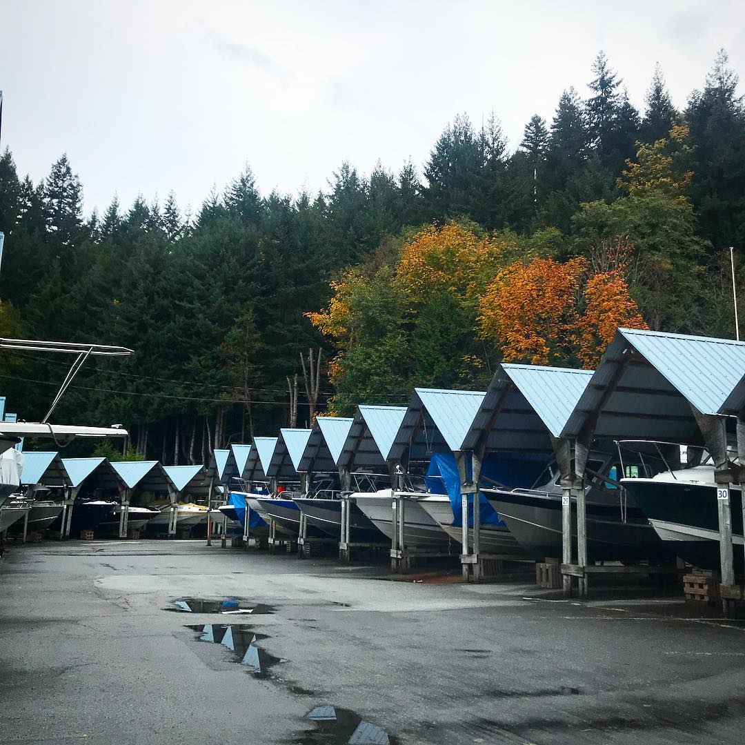 boats stored at an outdoor storage facility with coverings photo by Instagram user @notredawn