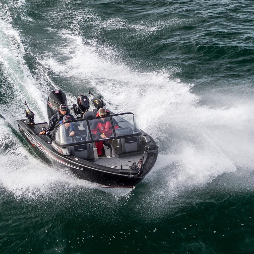 black aluminum fishing boat with three riders in the water photo by Instagram user @bps_boating_center_calgary