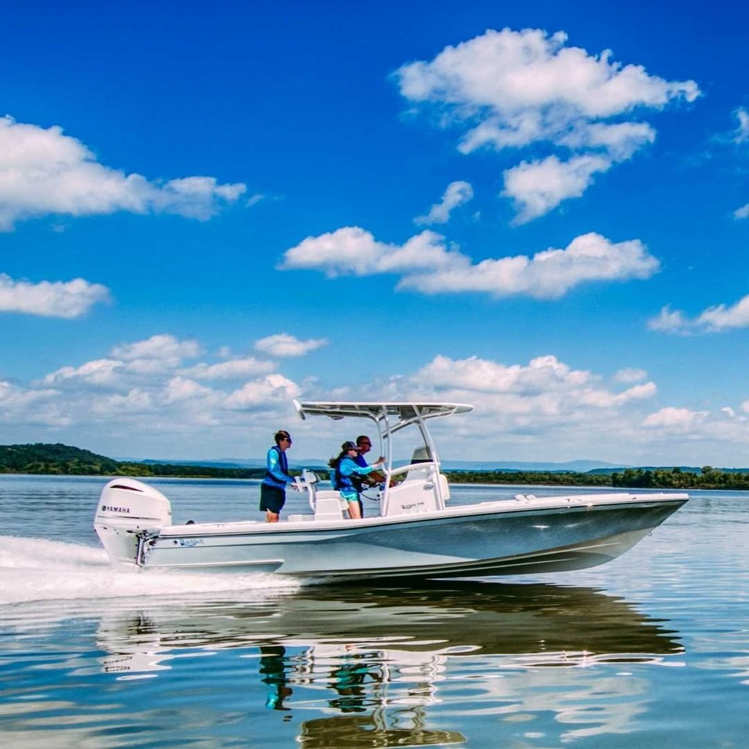 Three People Riding on the Water in a Bay Boat. Photo by Instagram user @officialblackjackboats