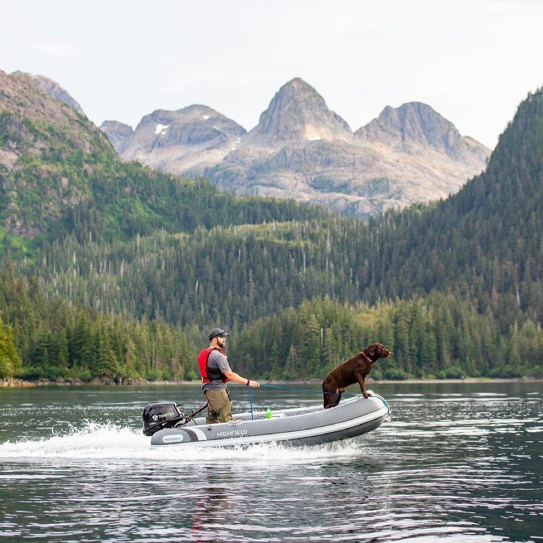 Guy and His Dog on a Dinghie. Photo by Instagram user @highfieldboats