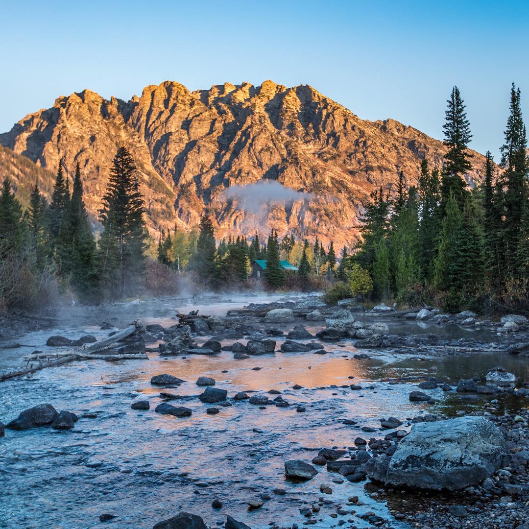Creek in Front of a Mountain Range in Grand Teton National Park. Photo by Instagram user @grandtetonnps