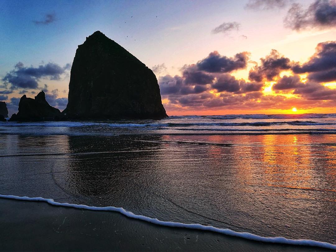 Sunset View of The Shore at Cannon Beach in Oregon. Photo by Instagram user@den_jara