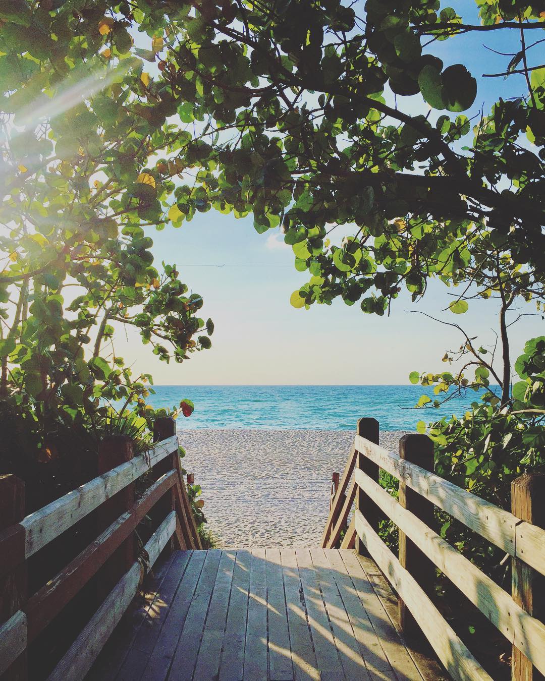 Bridge Leading to a Gorgeous White Sand Beach in Clearwater, FL. Photo by Instagram user @hflora