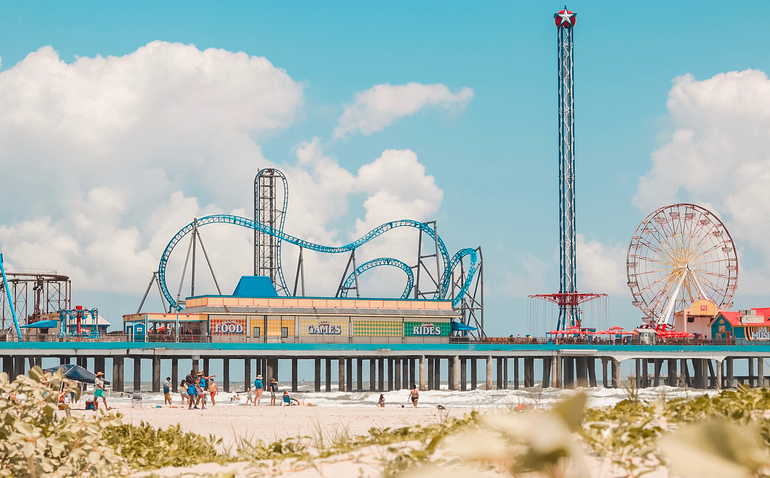 Roller Coasters and Amusement Rides at Pleasure Pier off Galveston Island. Photo by Instagram user @emibeaphotography 