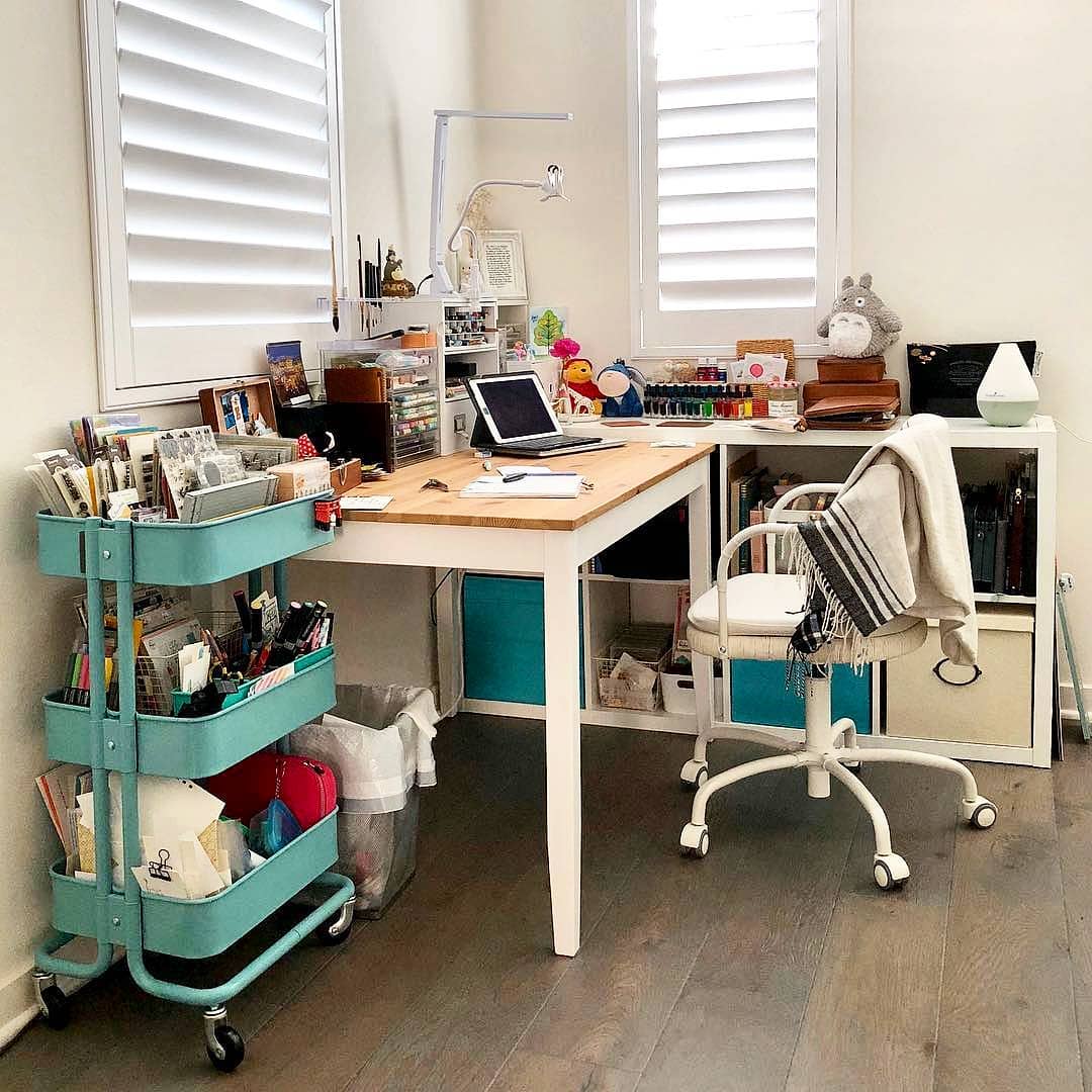 small desk set up in the corner of a art studio space for photo by Instagram user @thehomeofficer