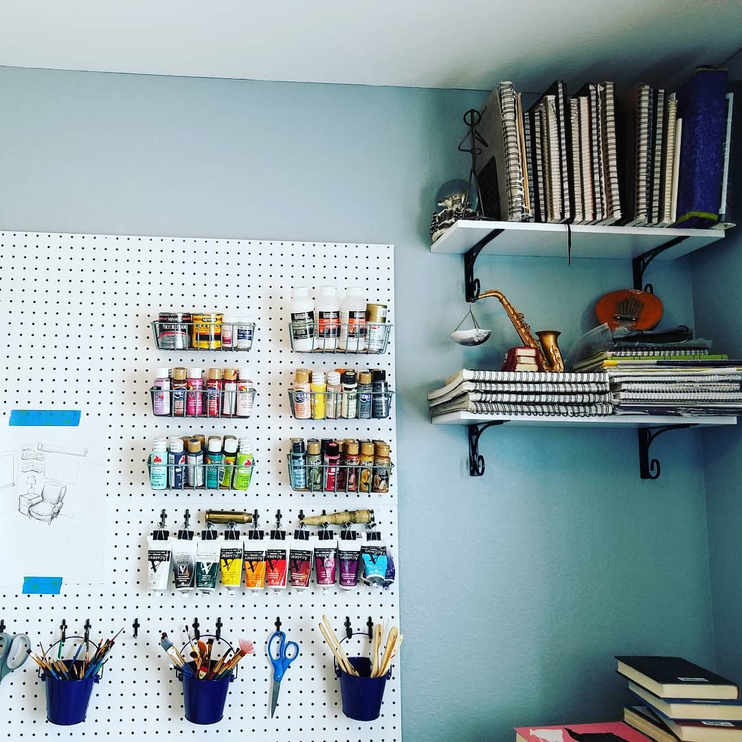 vertical storage used for more space in an art room at home photo by Instagram user @thewildship