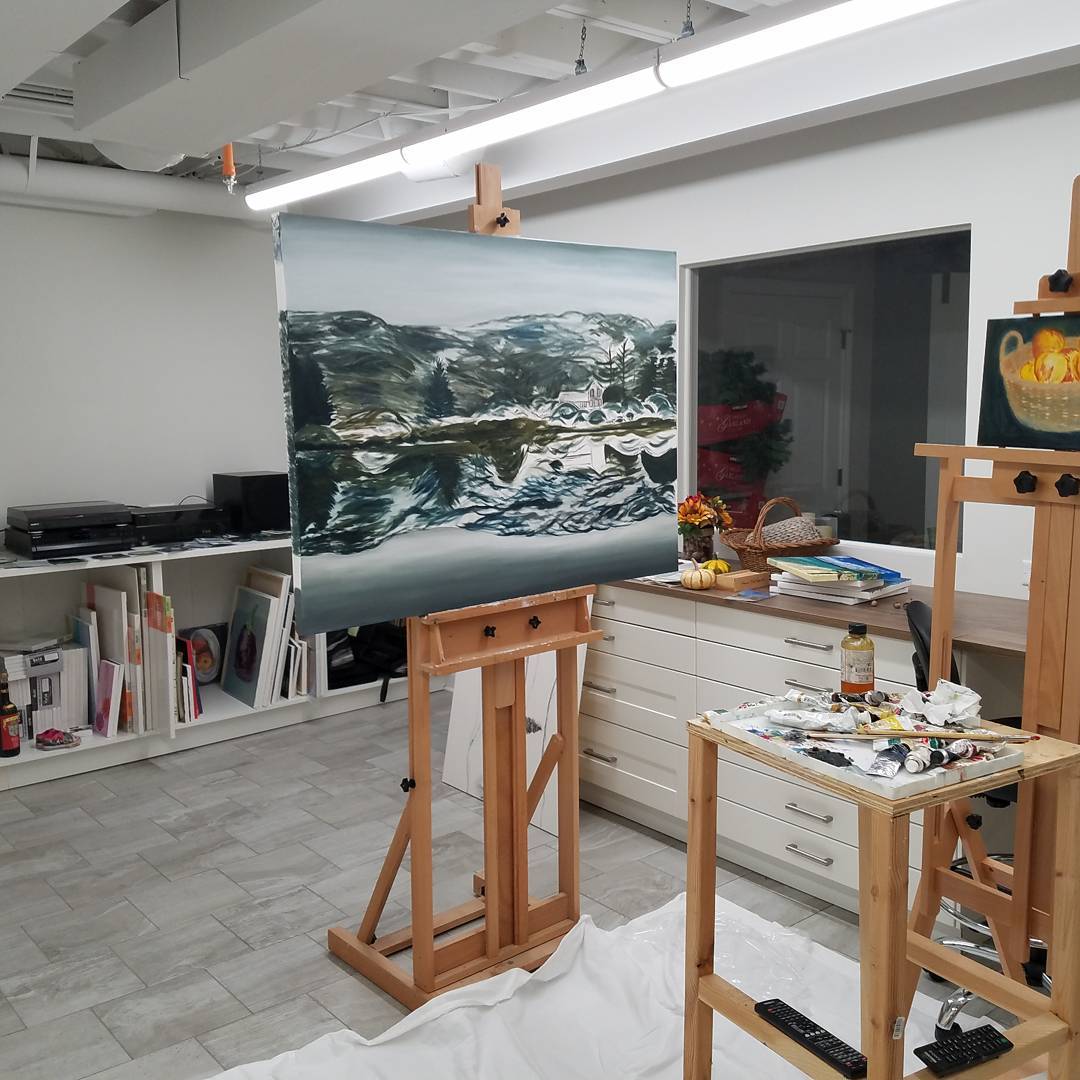 basement art studio with storage and easel in middle of the room photo by Instagram user @mauricegaan