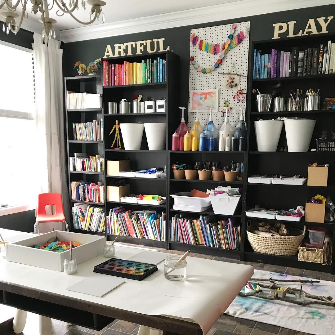 dining room set up with shelves holding craft items photo by Instagram user @artful_play