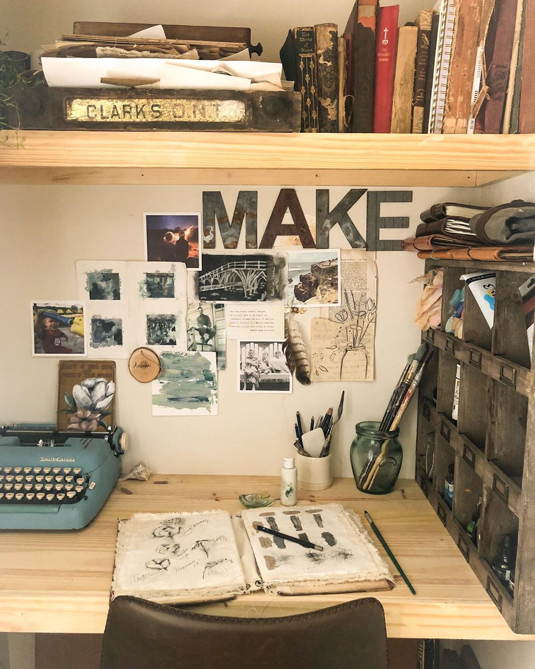 small closet with desk and art supplies set up on the desk photo by Instagram user @allthingsnewartanddesign