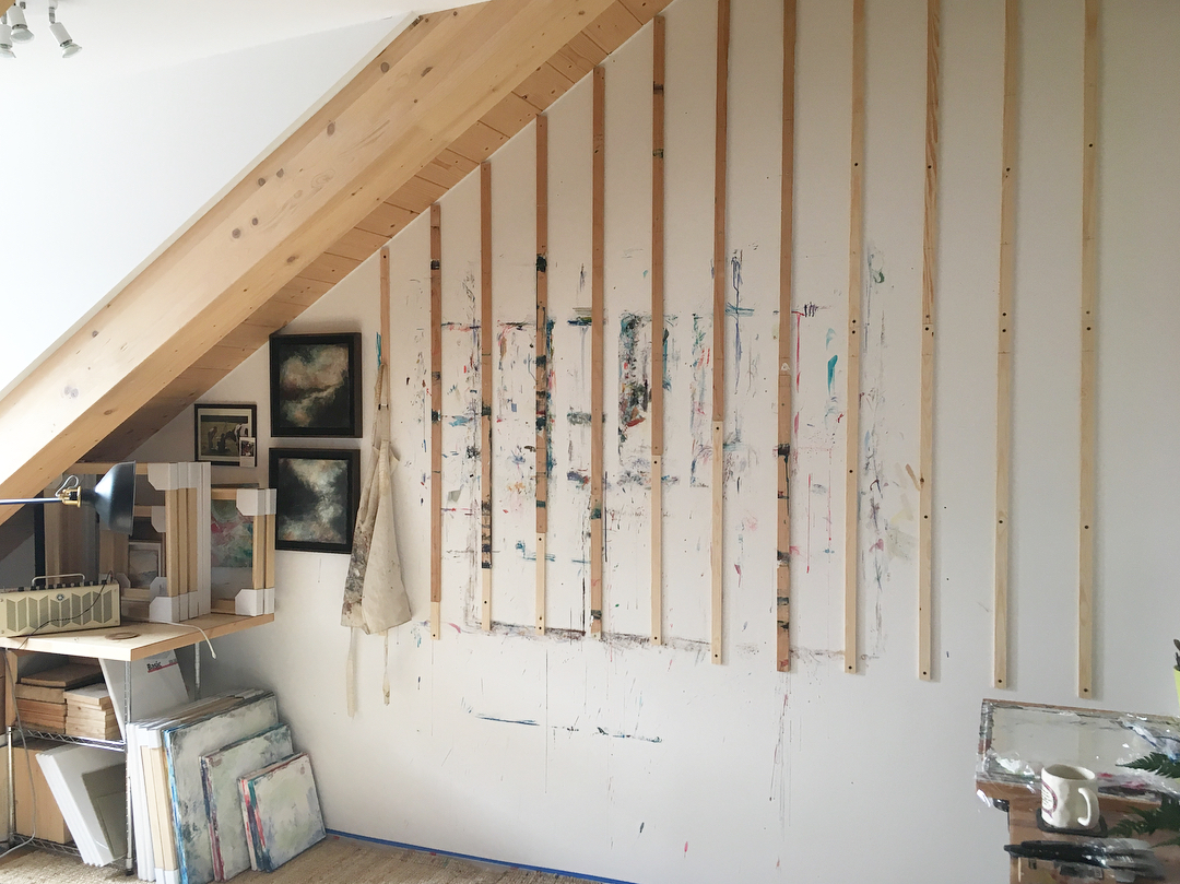 home art studio set up underneath the stairs photo by Instagram user @kellijoyart