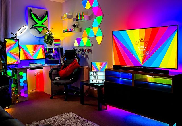 Game Room Set Up with Colorful Lights on the Wall and Bright Screen Backgrounds. Photo by Instagram user @xcalibur87psn