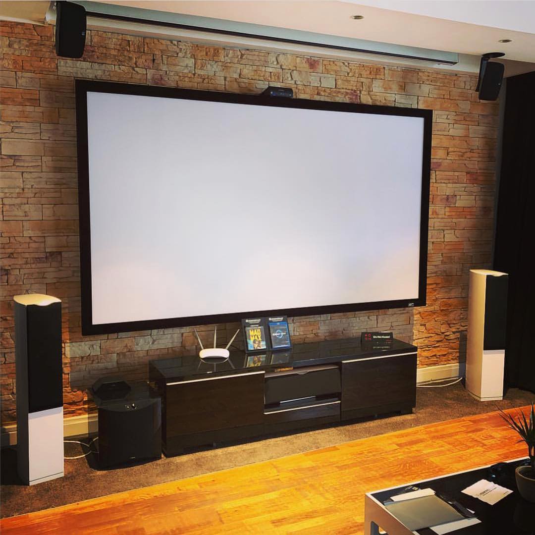 Giant projector screen in game room. Photo by Instagram user @elite_screens