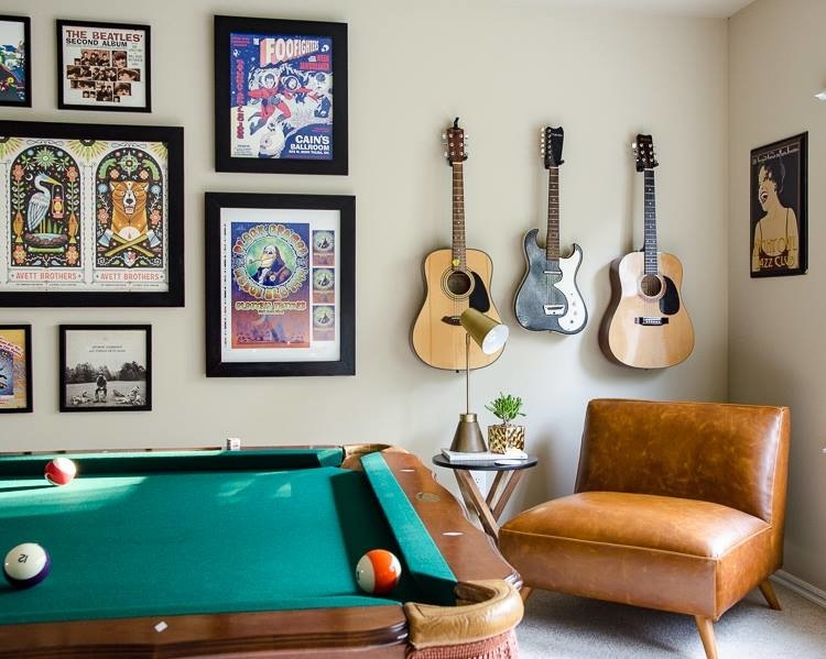 Room with pool table and guitars on wall. Photo by Instagram user @mediavine
