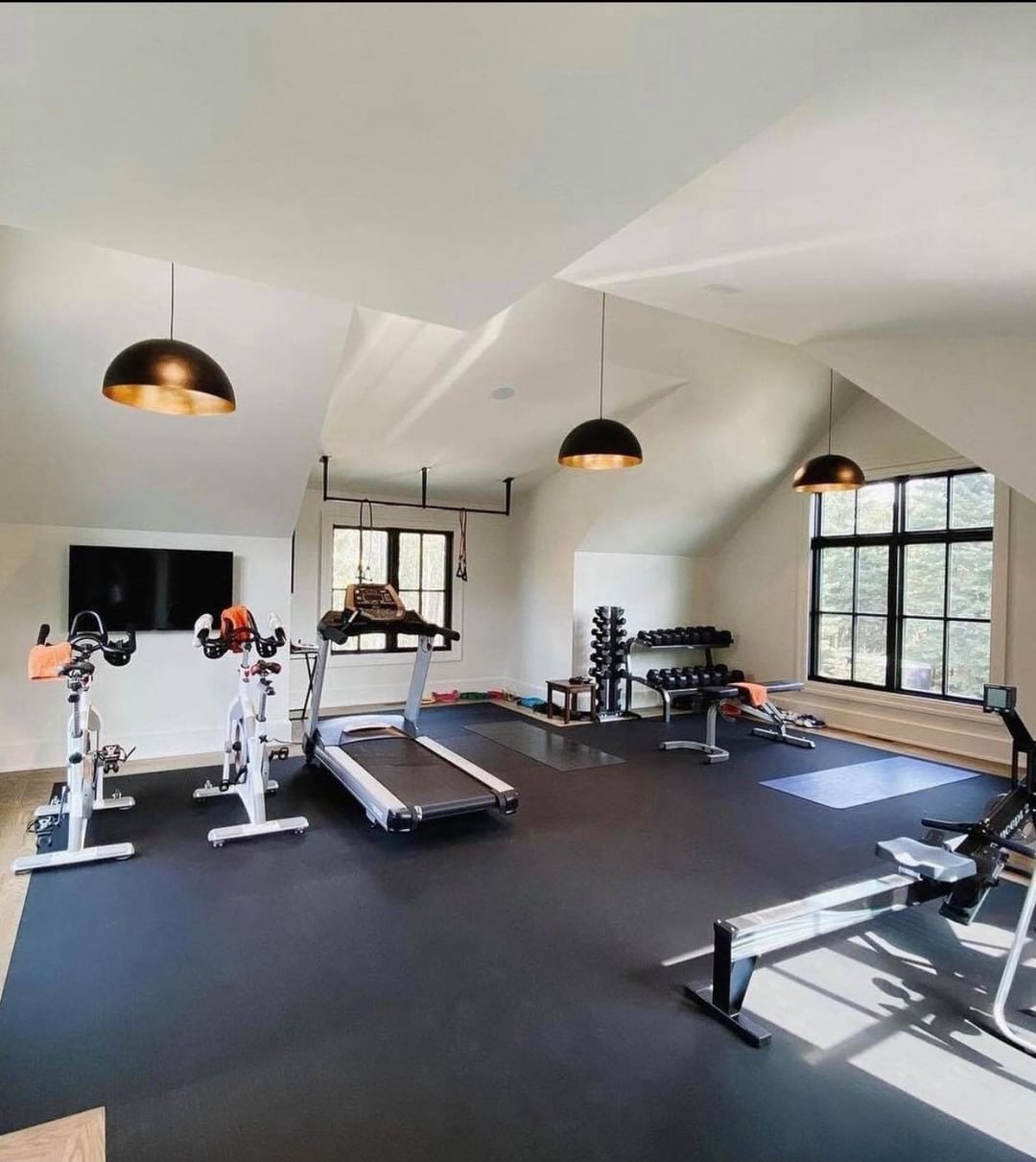 Home Gym Set Up in an Attic With Rubber Flooring. Photo by Instagram user @relaxwellnessbeauty