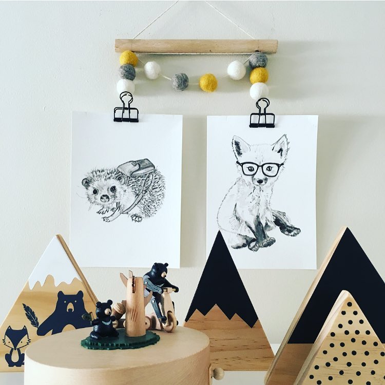 Drawing of a hedgehog and fox hanging on wall. Photo by Instagram use @nurseryroom