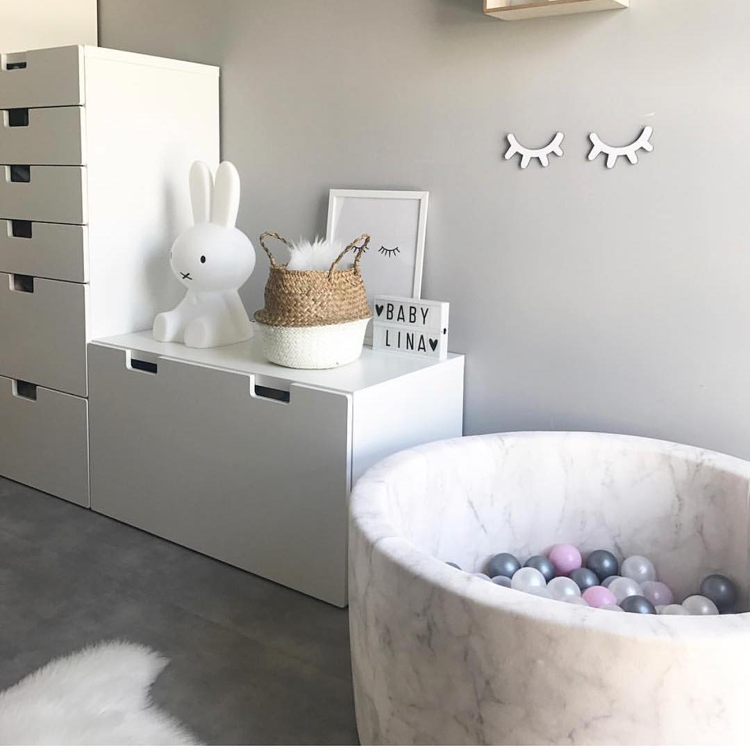 Grey kid room with marble-patterned ball pit. Photo by Instagram user @daisies_dinosaurs_decor