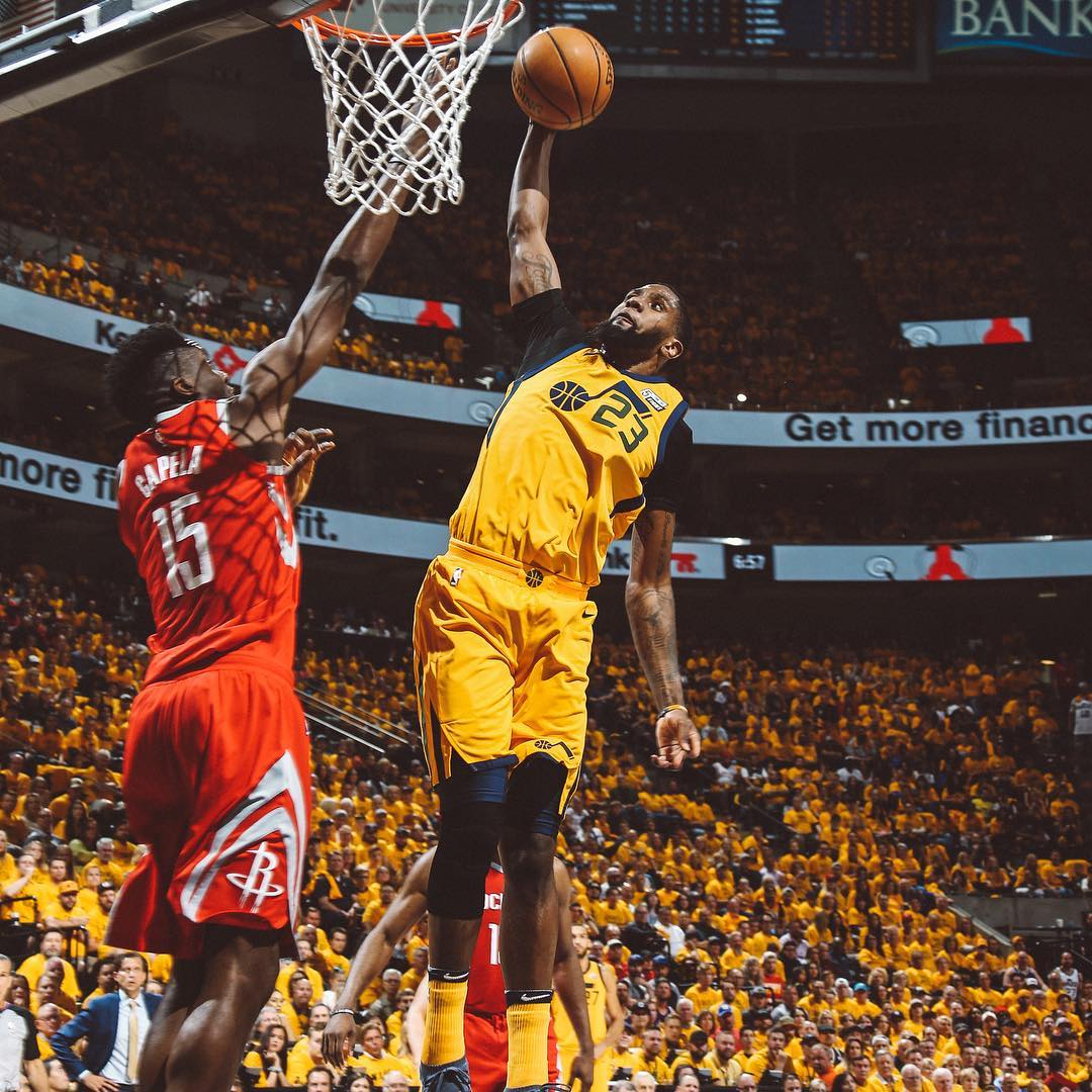 Royce O'Neale slam dunks the basketball. Photo by Instagram user @utahjazz