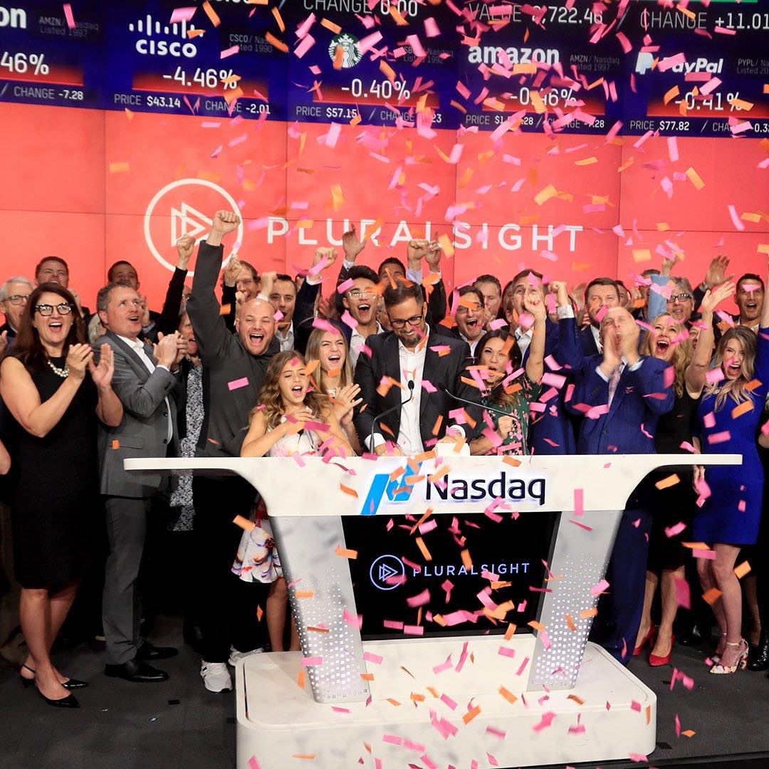 A group of people ring the bell for the Nasdaq as confetti falls. Photo by Instagram user @siliconslopes