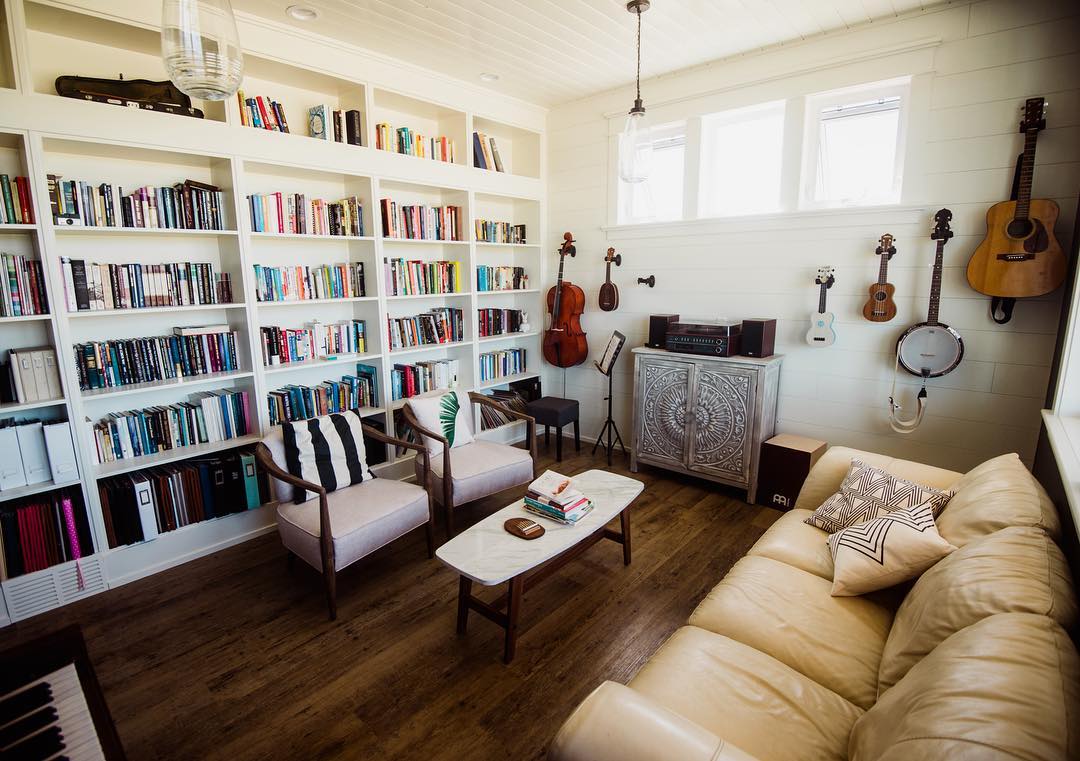 music room set up with books on shelves for acoustics photo by Instagram user @justrhondalee