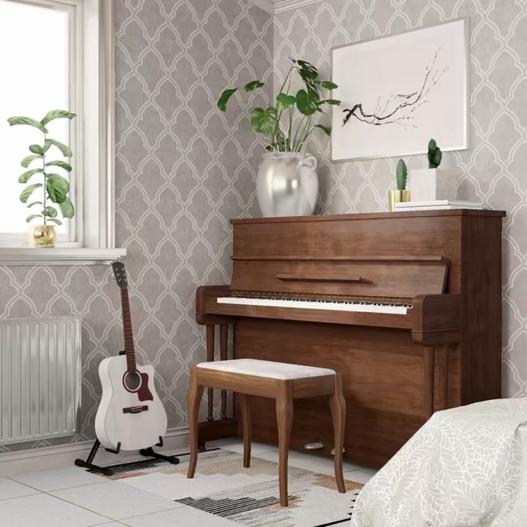 small piano and white guitar in music room with plants nearby photo by Instagram user @lujo.vivo