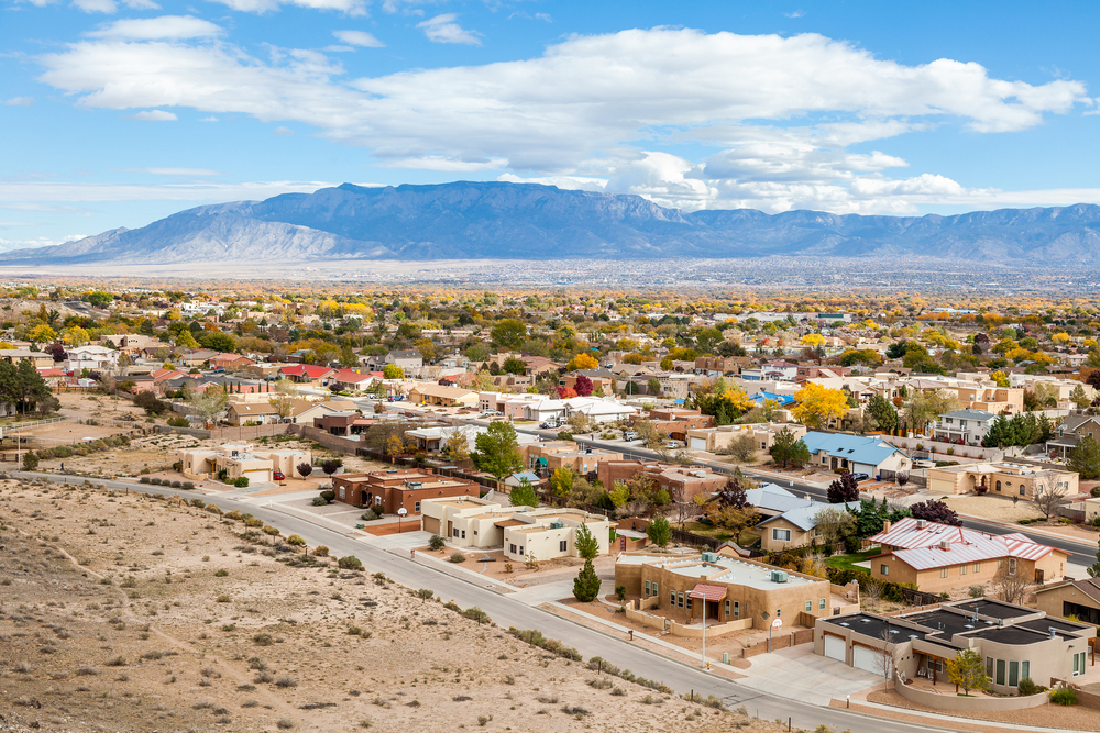 aerial view of Albuquerque, NM neighborhood with mountains in the back