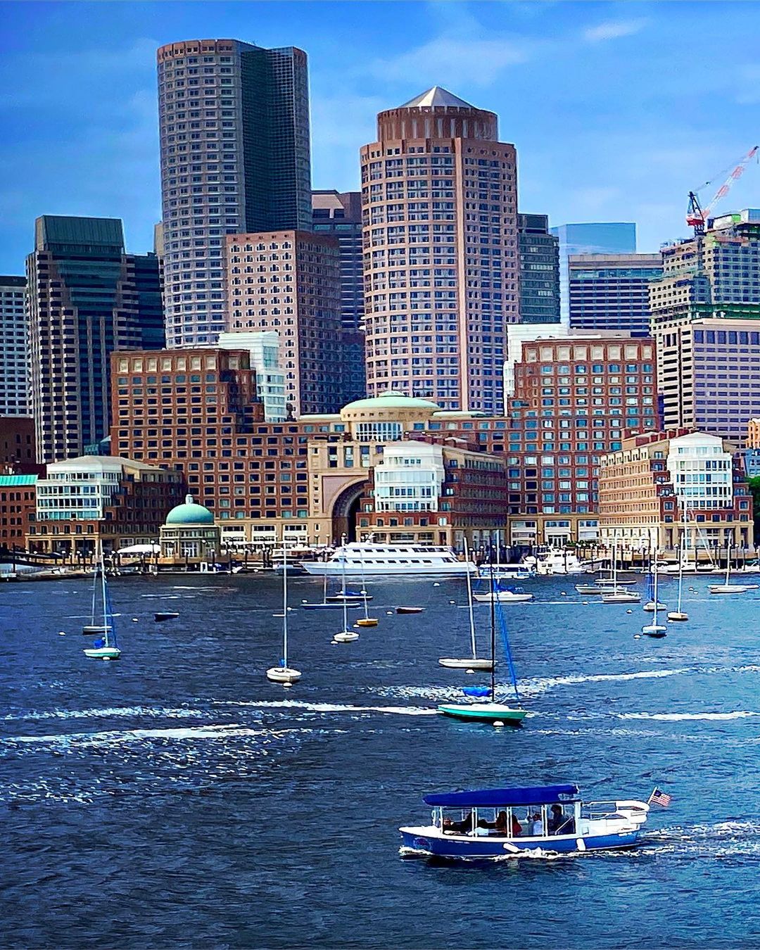 Boston Harbor Filled with Boats During the Day. Photo by Instagram user @rlonpine