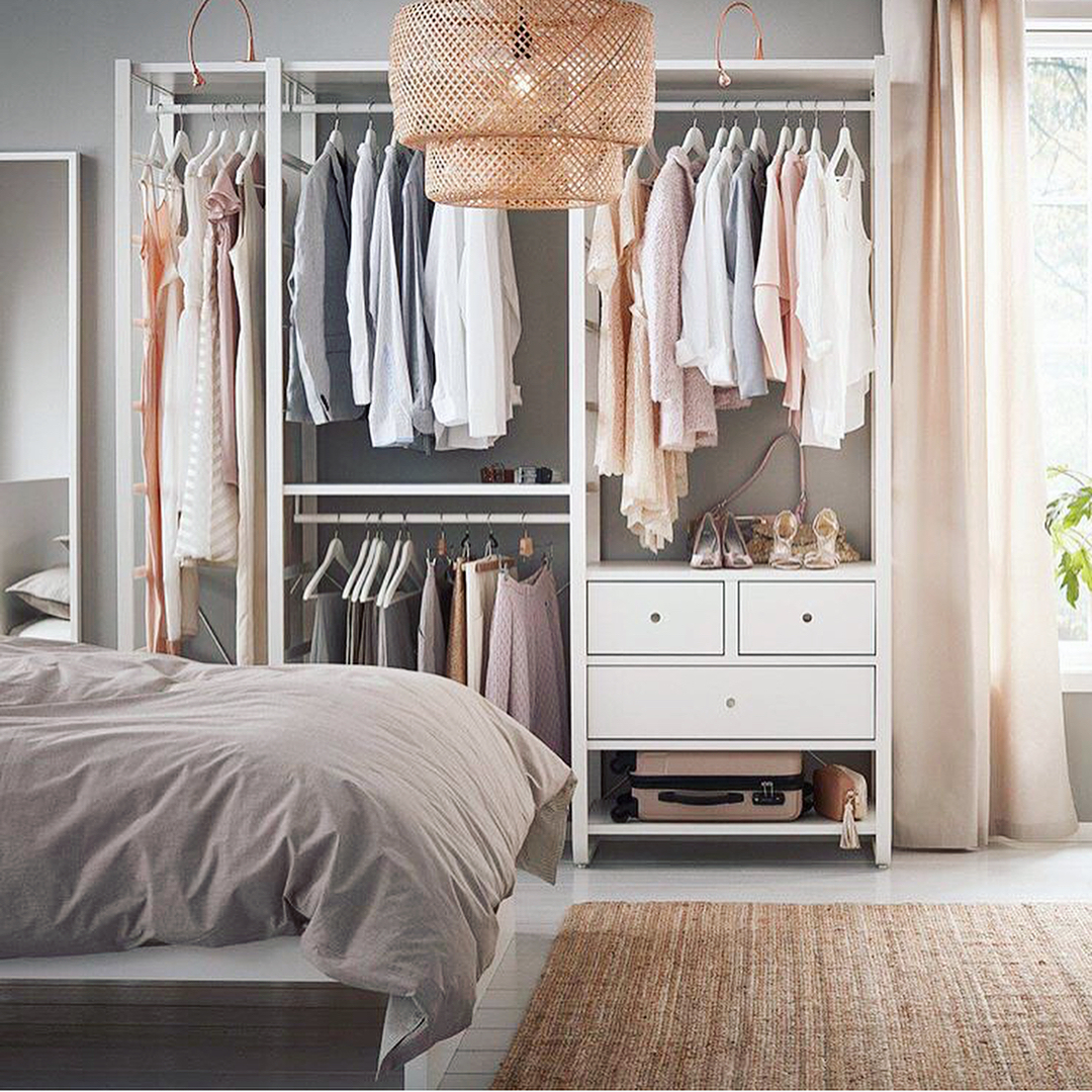 Standalone wardrobe closet in studio apartment. Photo by Instagram user @organizational.logistics