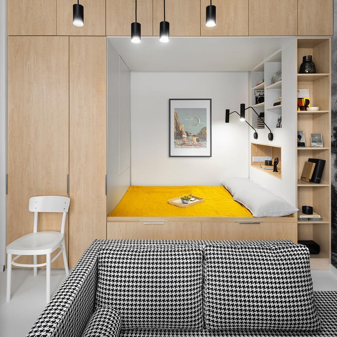bed with closet built in and storage placed around it photo by Instagram user @reklektik