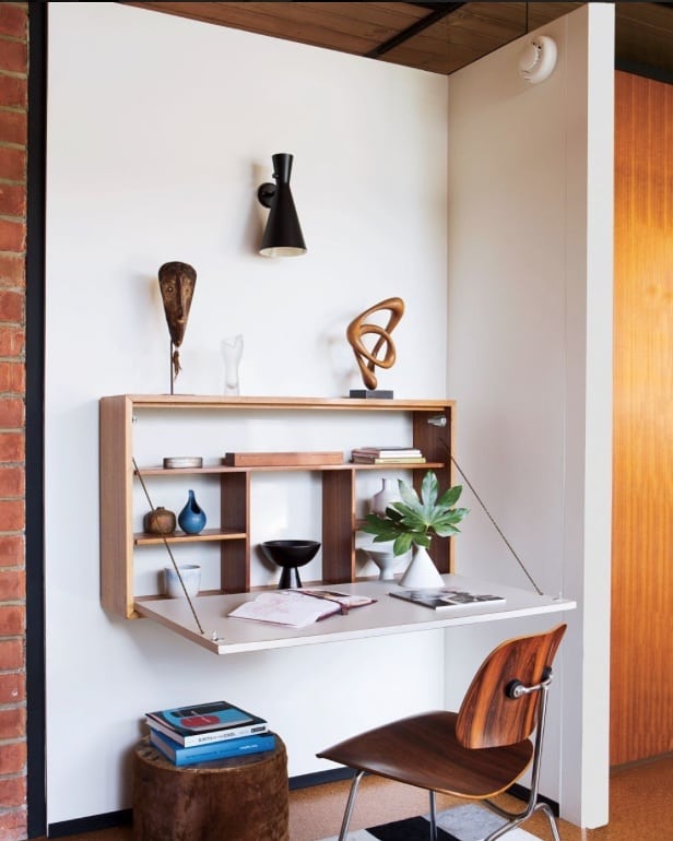 homemade hidden desk installed on a wall photo by Instagram user @commedesepices