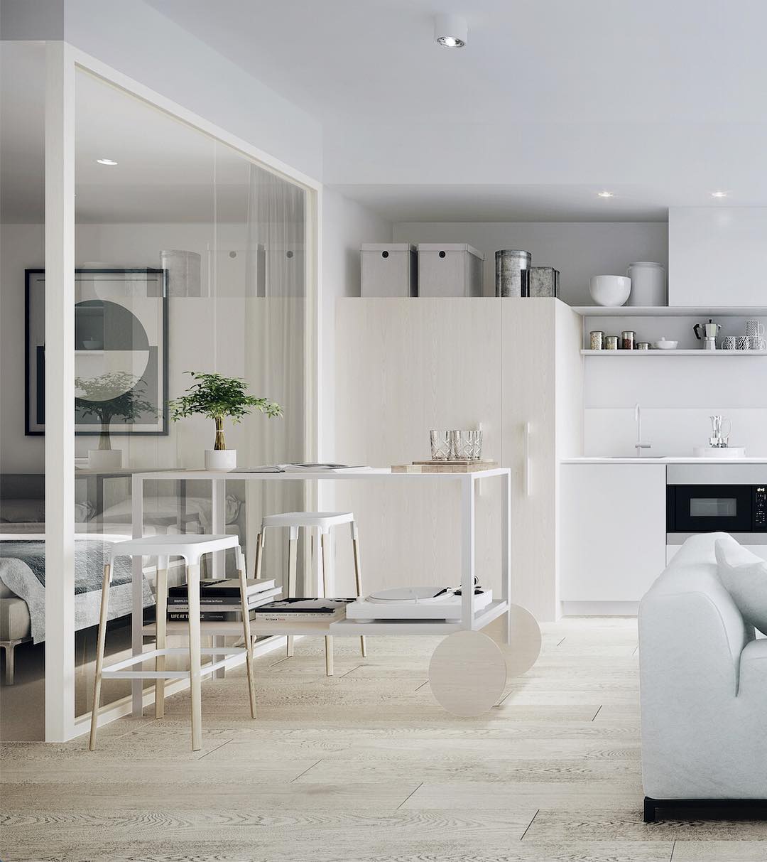 studio apartment space utilizing minimalist design with limited white furniture photo by Instagram user @birddelacoeurarchitects