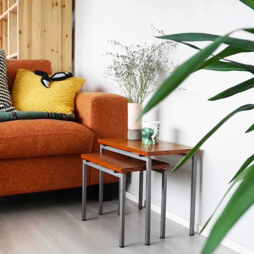 Nesting tables in living room for space-saving. Photo by Instagram user @indehut